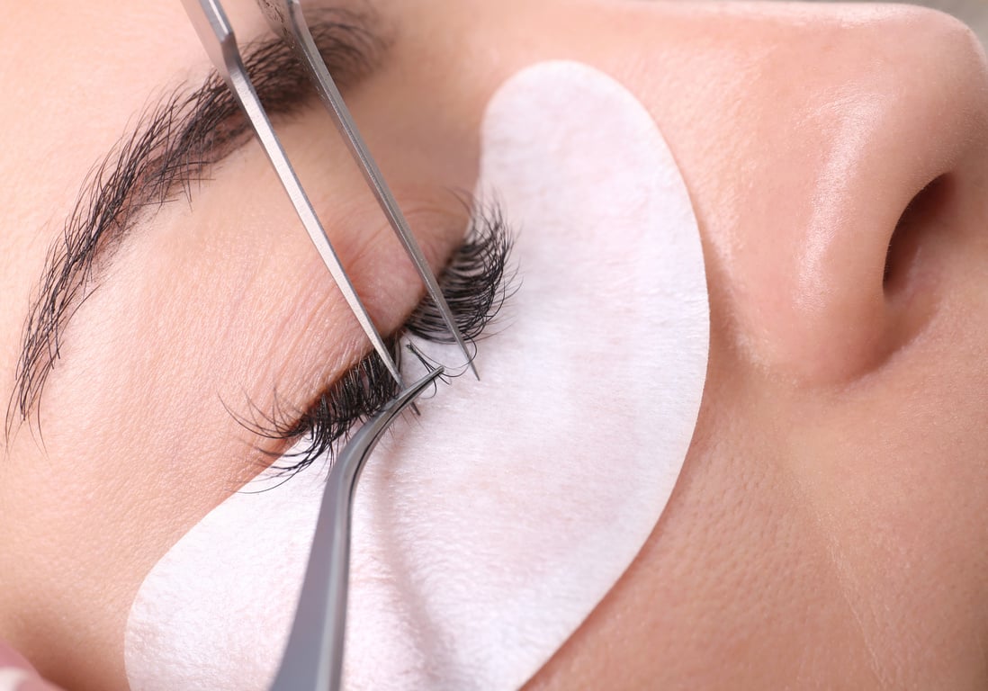 Young Woman Undergoing Eyelash Extensions Procedure